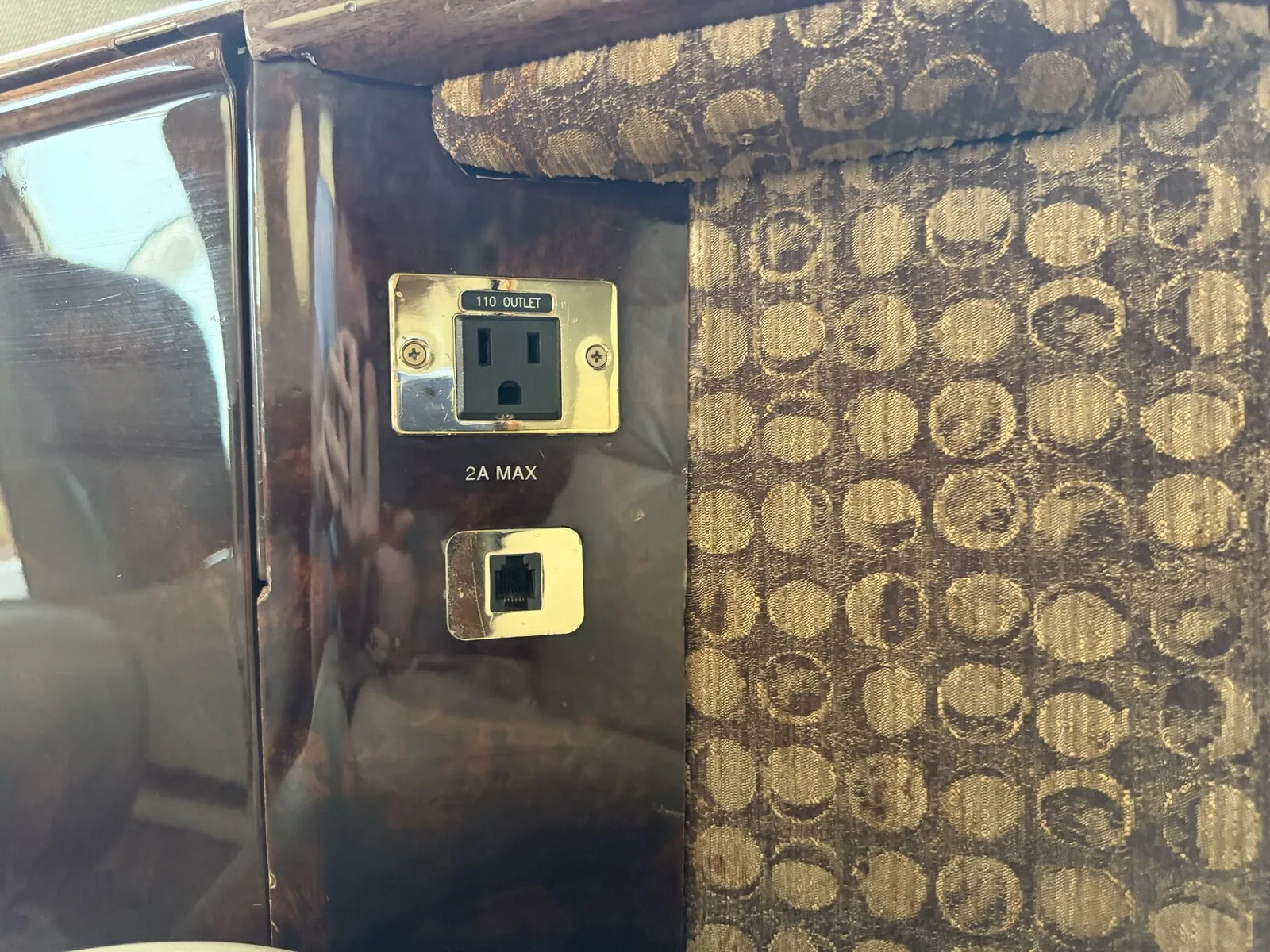 110V outlet and data port at the cabin sidewall of the Citation CJ1