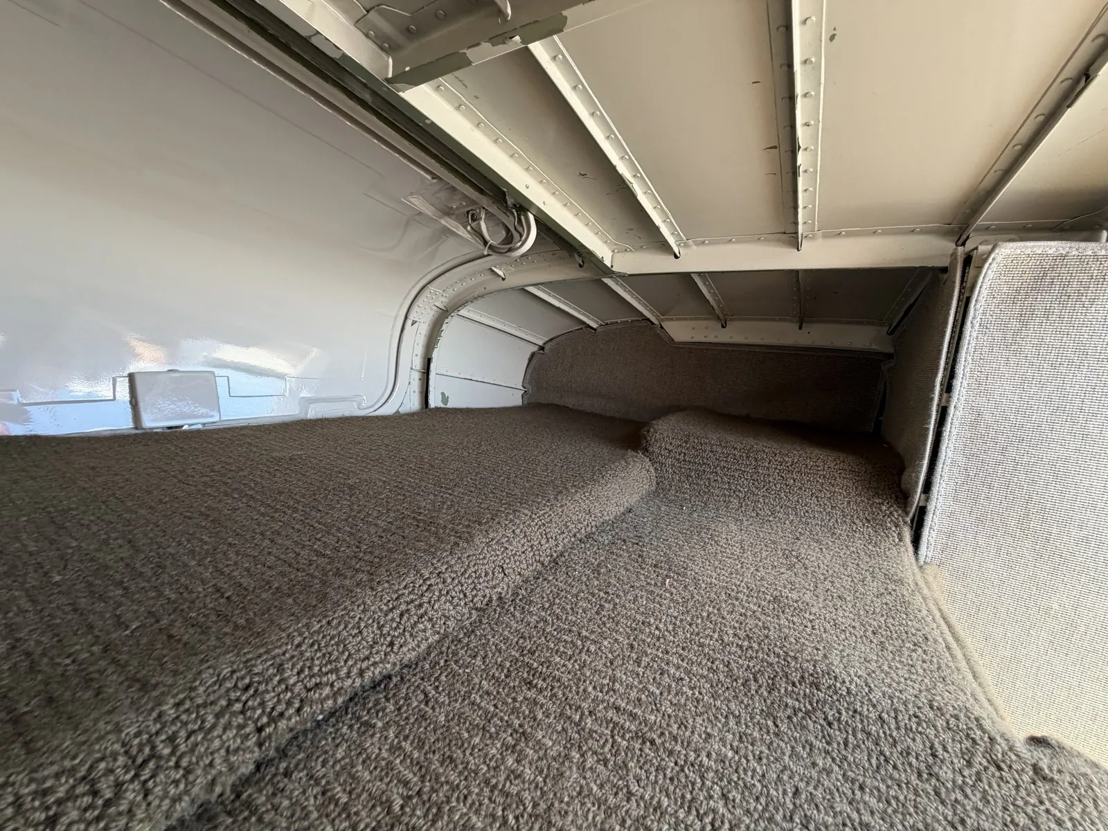 Inside the CJ1’s aft baggage bay — the added-length ski-tube extension takes skis and similar long items
