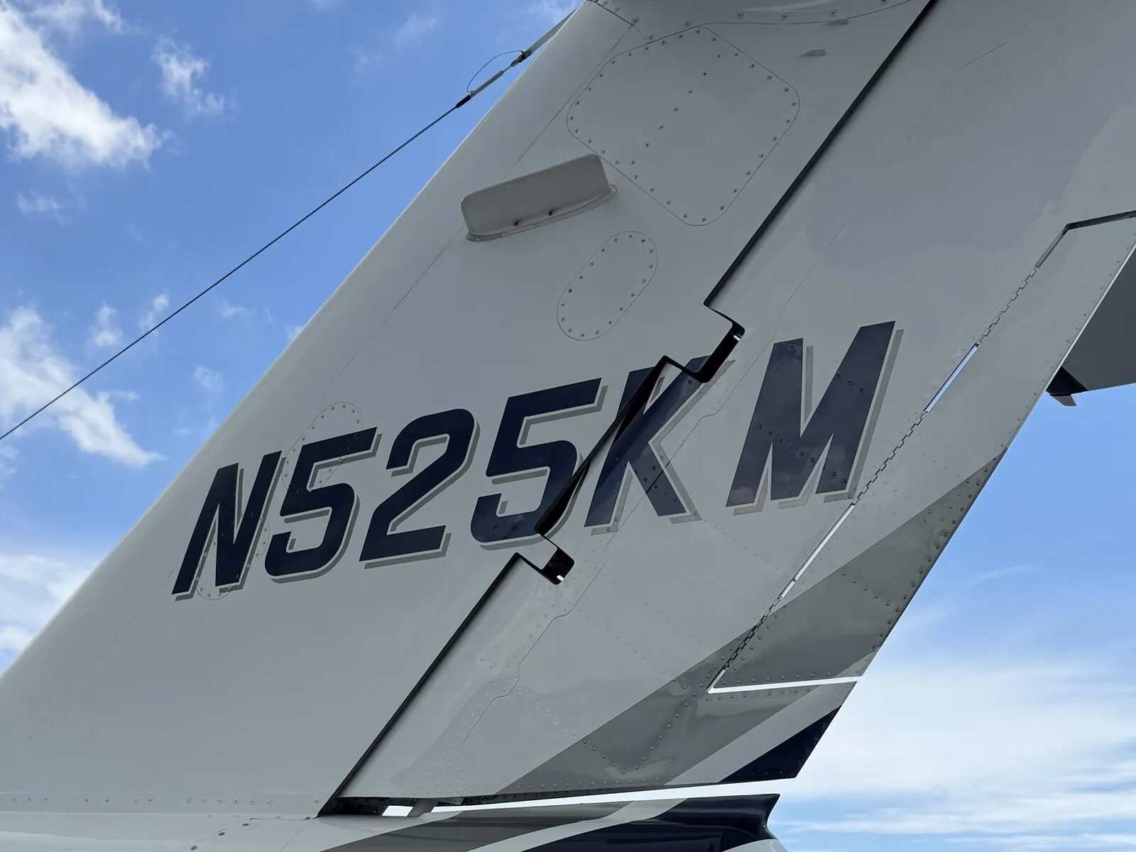 The CJ1’s tail with N525KM registration